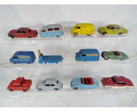 Dinky Toys - 12 diecast models comprising two Bedford vans 'Ovaltine', Standard Atlas, Bedford van marked 'Dinky Toys', BEV t