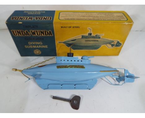 Sutcliffe Models - A Sutcliffe Models 'Unda - Wunda' tinplate clockwork diving submarine in light blue, 'Unda - Wunda' decals