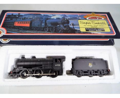 Bachmann Branch-Line - an OO gauge 0-6-0 locomotive and tender, op no.64958, black BR livery, #31-851A, in original box