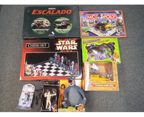 A good mixed lot to include a Star Wars chess set, a limited edition Monopoly Chester and Cheshire edition, Chad Valley Escal