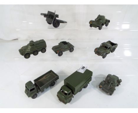 Dinky Toys - eright diecast military vehicles comprising Army wagon with driver figure # 623, 1 ton Cargo truck # 641, 3 ton 