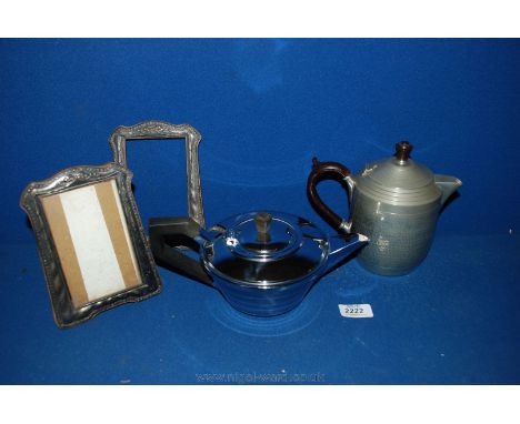 An English Pewter coffee Pot, an art deco style Teapot and a pair of old photograph Frames.