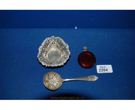 An EPNS sifter spoon and trinket dish and a ruby glass bottle.
