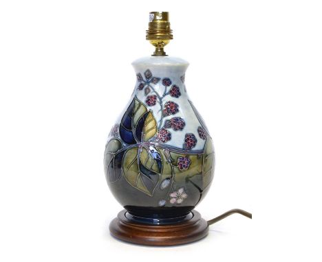 Moorcroft Lamp Base in Bramble Pattern Moorcroft bramble pattern lamp base, in green and blue with a turned wooden base, wire