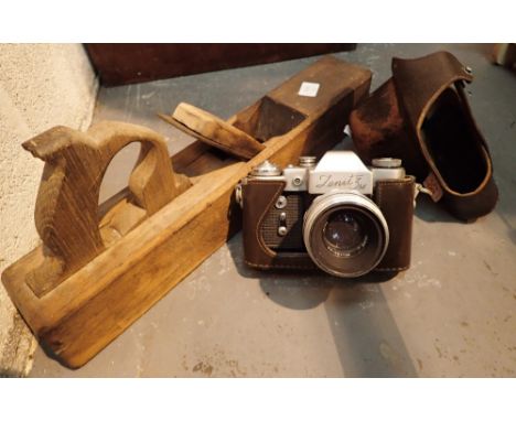 Zenith 35 mm SLR camera and a wooden block plane 