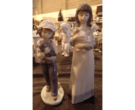 Pair of Lladro and Nao boy / girl and puppy figurines