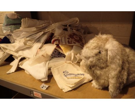 Shelf of linen with bunny and knitted scarecrow 