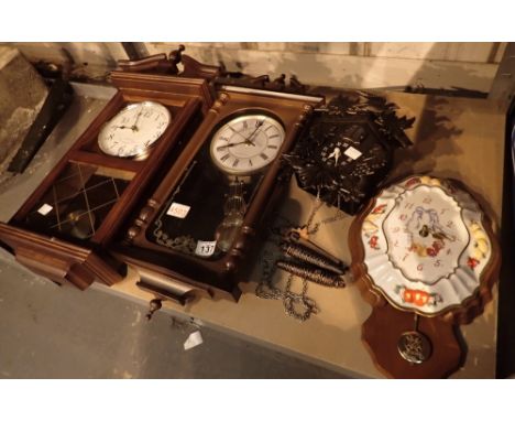 Four wall clocks including cuckoo and ceramic 