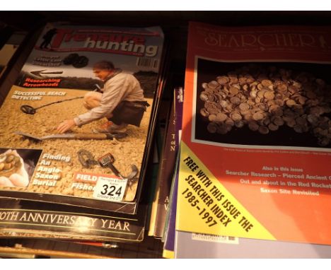 Vintage suitcase of treasure hunting magazines