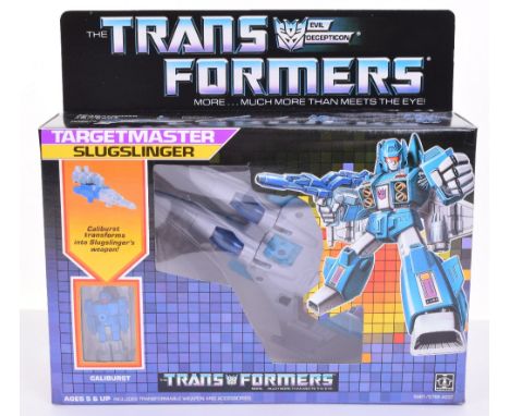 Boxed Hasbro G1 Transformers Targetmaster ‘Slugslinger’1986 issue, transforms from jet to robot and back! In mint boxed compl