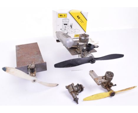 Four Combustion Engines,Irvine 40 on mount with propeller and silencer,instruction leaflet and lid of box, plus 3 other engin