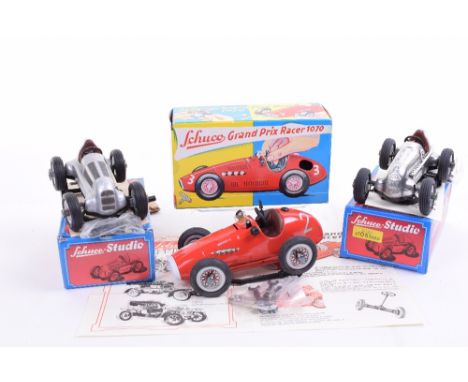 Three Boxed Schuco Models, Grand Prix Racer 1070 and two silver Studio Mercedes Grand Prix Cars, all complete with tools, key