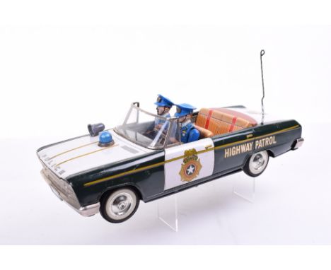 Nomura (Japan) Large scale Battery operated Police Command Car, in green and white bodywork finish with badges to doors and ‘