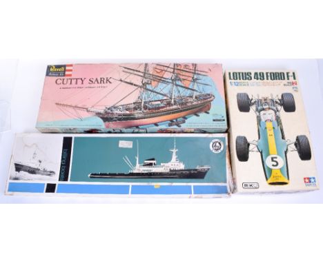Seven various plastic and wooden kits, Tamiya 1/12 scale Lotus 49 Ford F-1, parts still in unopened plastic bags, box dirty, 