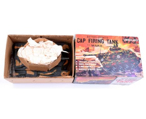 Louis Marx Battery Operated Cap Firing Tank, plastic camouflaged body, rubber tracks,complete in near mint boxed condition, c