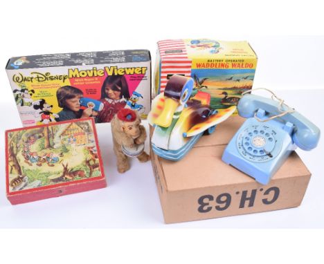 A Boxed Mettoy Walt Disney Movie Viewer, boxed battery operated Clifford series waddling duck, boxed Playcraft telephone set,