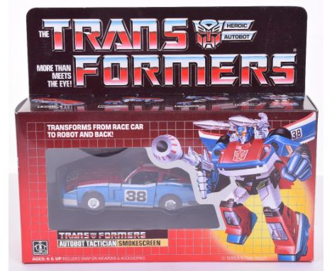 Boxed Hasbro G1 Transformers Autobot Tactician ‘Smokescreen’ 1985 issue, transforms from racecar to robot and back in mint bo