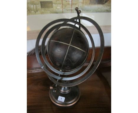 A BRONZED ARMILLARY SUNDIAL raised on a circular spreading foot 52cm high