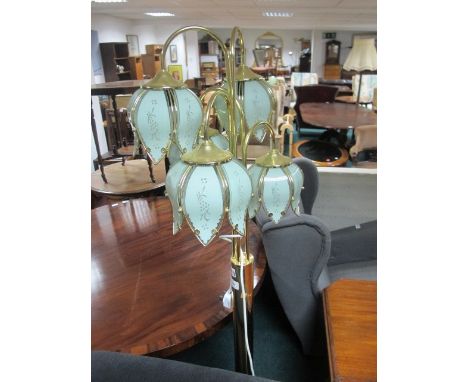 A BRASS FIVE BRANCH FLOOR STANDARD LAMP raised on a circular spreading foot 168cm high