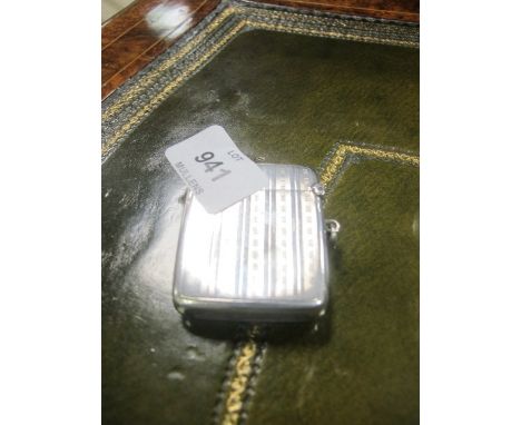 A SILVER ENGINE TURNED VESTA CASE monogrammed "W J H"