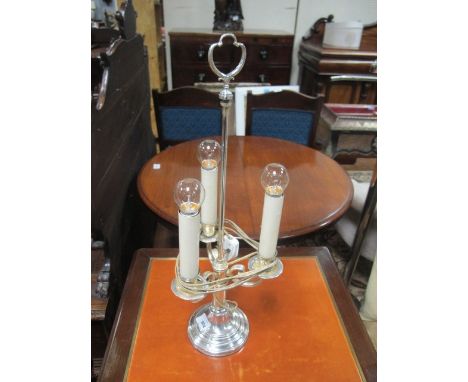 A SILVER PLATED THREE BRANCH TABLE LAMP with scroll arms raised on a circular spreading foot