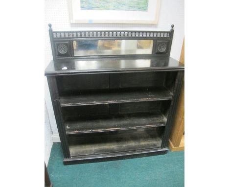 AN EDWARDIAN EBONISED BOOKCASE the super structure with plate glass mirror, carved panels above four open shelves on bracket 