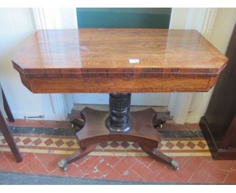 A GOOD REGENCY ROSEWOOD CARD TABLE with satinwood cross banding fluted pillar and platform base