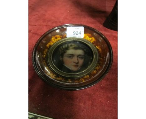 A MINIATURE PORTRAIT in simulated tortoise shell frame 15cm diameter