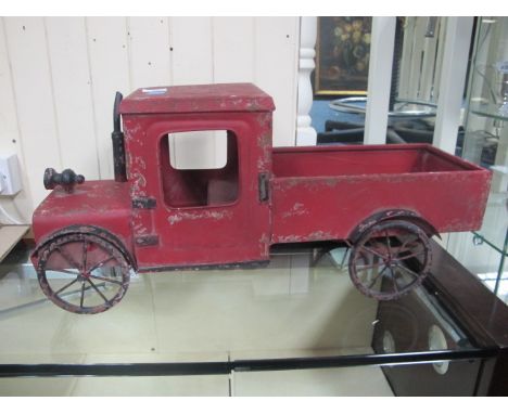 A TIN PLATE MODEL OF A VINTAGE TRUCK