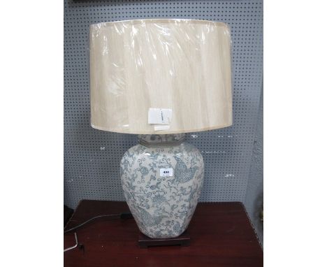 A POTTERY LAMP decorated in Chinese motifs together with pleated shade