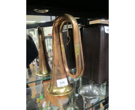 A COPPER AND BRASS BUGLE inscribed "Class A Boosey & Company London"
