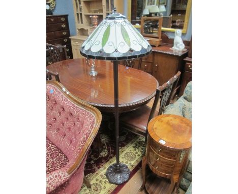 AN ART DECO STYLE STANDARD LAMP with bedded glass shade and moulded base 160cm high