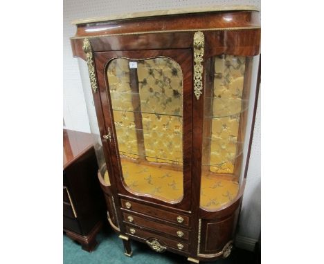 A CONTINENTAL WALNUT AND GILT BRASS MOUNTED CHINA DISPLAY CABINET surmounted with a vein marble top on a conveto frieze with 