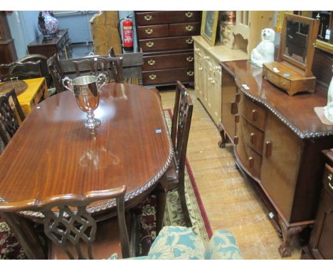 A CHIPPENDALE STYLE MAHOGANY DINING ROOM SUITE comprising an oval rope edged table and six matching cabriole leg chairs toget