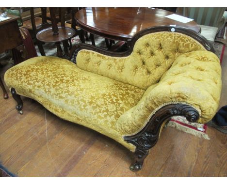AN EDWARDIAN MAHOGANY CHAISE LONGUE the carved top rail above a button upholstered panel and seat on cabriole legs 175cm long
