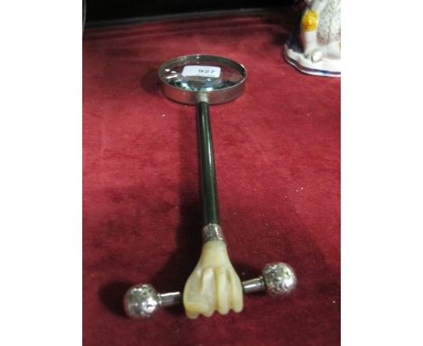 A MOTHER OF PEARL HANDLE AND SILVER MOUNTED MAGNIFYING GLASS