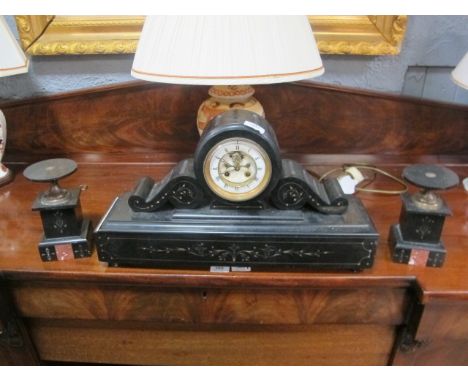 A VICTORIAN BLACK SLATE THREE PIECE CLOCK GARNITURE the clock with white circular enamel and gilt dial