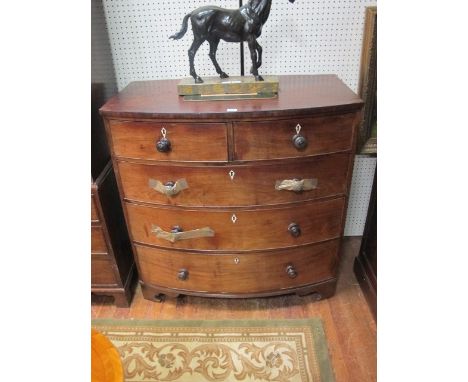 A GEORGIAN MAHOGANY BOW FRONT CHEST of two short and three long graduated drawers 109cm wide