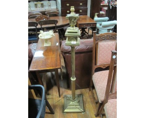 A REGENCY STYLE BRASS STANDARD LAMP with fluted column