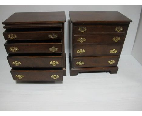 A GOOD PAIR OF GEORGIAN STYLE WALNUT CHESTS with four long graduated drawers and brass drop handles on bracket feet 76cm (h) 