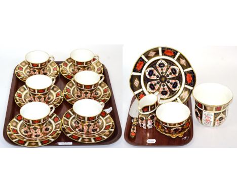 A group of Royal Crown Derby Imari tea wares comprising six tea cups, saucers and side plates, a cake plate, a cake slice, cr