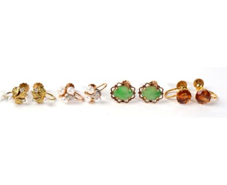 A pair of cultured pearl and diamond earrings, a cultured pearl to a cluster of leaves set with two round brilliant cut diamo