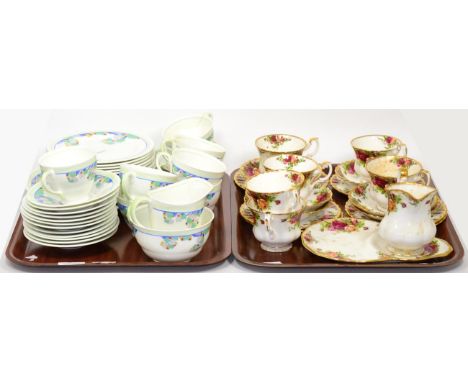 A Royal Albert Old Country Roses part tea service together with a Royal Doulton Art Deco part tea set