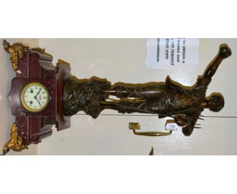 A French spelter and rouge marble figural mantel clock striking on a bell