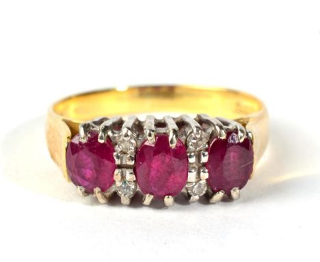 An 18 carat gold diamond and ruby set ring 