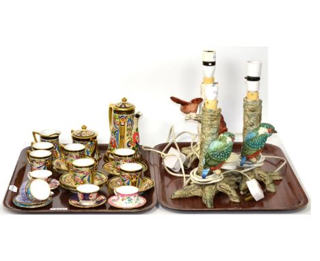A Noritake gilt and floral coffee set; three Goebel bird table lamps; and five miniature cups and saucers 