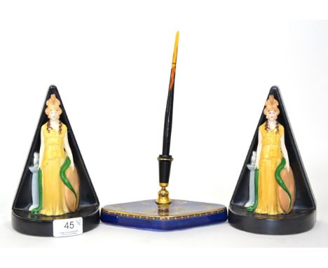 A pair of Carlton ware 1930s bookends modelled as Minerva together with a Carlton ware quill holder 