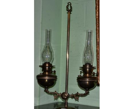 An adjustable twin branch oil lamp 