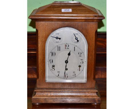 An oak chiming mantel clock 