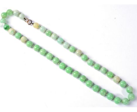 A jade bead necklace, uniform round jade beads knotted to a spring ring clasp, length 45cm, beads measure 8.2mm-9.7mm, 58.4g